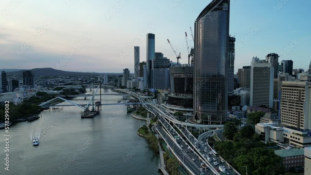 Drone shot rotating around Brisbane's Queens Wharf Casino development. Brisbane River and busy traffic Riverside Motorway in shot. New Bridges in construction. Multiple construction cranes at work. 4k Drone shot rotating around Brisbane's Queens Wharf Casino development. Brisbane River and busy traffic Riverside Motorway in shot. New Bridges in construction. Multiple construction cranes at work. 4k