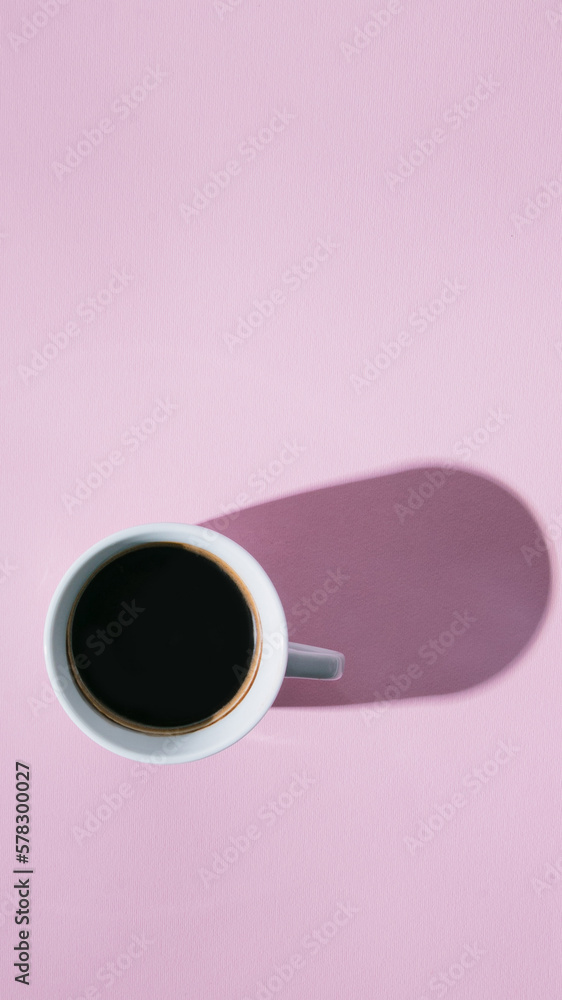 Coffee or tea cup on a pink pastel background.Flat lay.Minimal morning concept. Coffee or tea cup on a pink pastel background.Flat lay.Minimal morning concept.