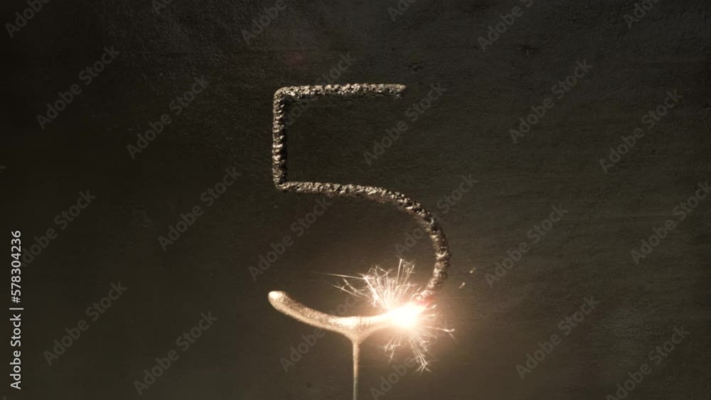 number five sparkler with a gold metal background loop