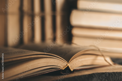 Vintage, antiquarian books pile on wooden table