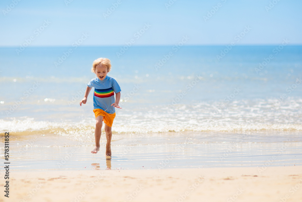 Kids playing on beach. Children play at sea. Kids playing on beach. Children play at sea.