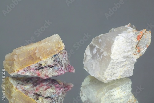 Crystals of two major industrial lithium ores.  Left spodumene, right petalite.  Sample from Haapaluoma lithium quarry in Finland. photo