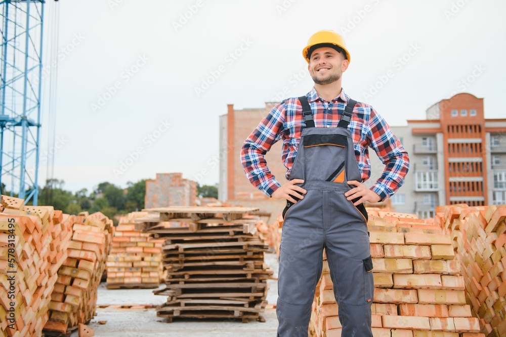 construction mason worker bricklayer installing red brick with trowel putty knife outdoors. construction mason worker bricklayer installing red brick with trowel putty knife outdoors.