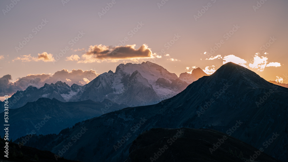 Sunset in the ranges and snow capped mountains of Dolomites, Italy