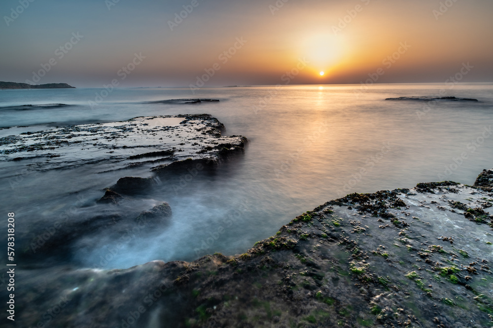 Sunset over rocky seashore Palmachim beach Israel Sunset over rocky seashore Palmachim beach Israel