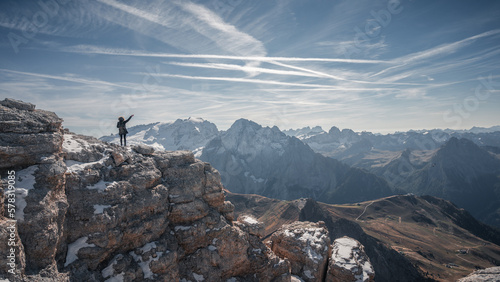 Woman enjoying the top of the mountain, overlooking a snowy range, Dolomites Italy © Fuentes RAW