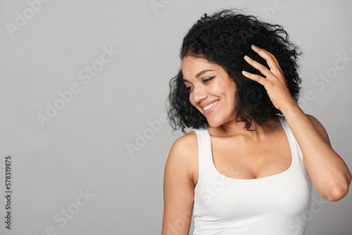 Fotografi Happy smiling mixed race girl looking to side at blank copy space