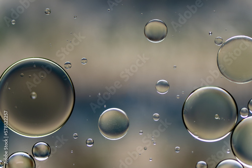 Abstract colorful bubbles. Soft background with blue and soft yellow colors.