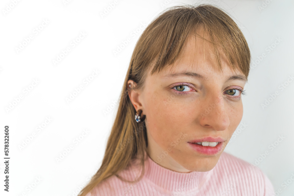 young Caucasian girl looking into the camera, closeup isolated on white background. High quality photo young Caucasian girl looking into the camera, closeup isolated on white background. High quality photo