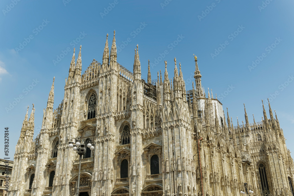 Milan, Italy Duomo di Milano front and side view. External day view of the Roman Catholic cathedral church of Milan.