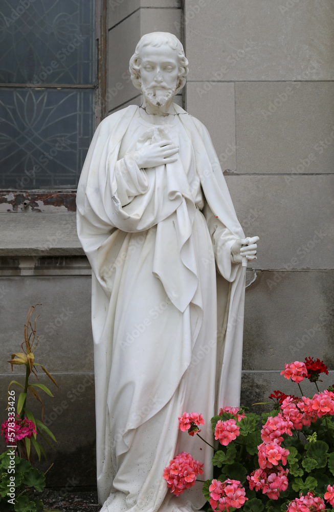 Old Marble Statue of Jesus with Flowers in Indianapolis, Indiana