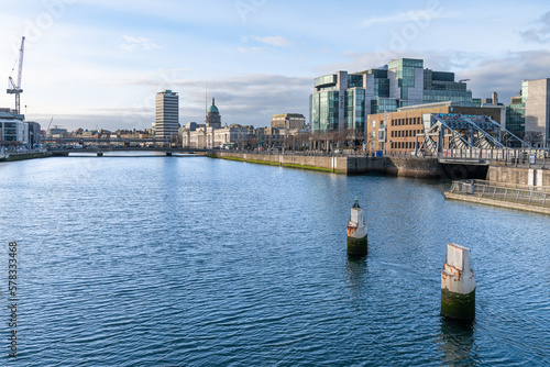 The River Liffey through Dublin, Ireland looking upstream from the Sean Casey Footbridge © dvlcom