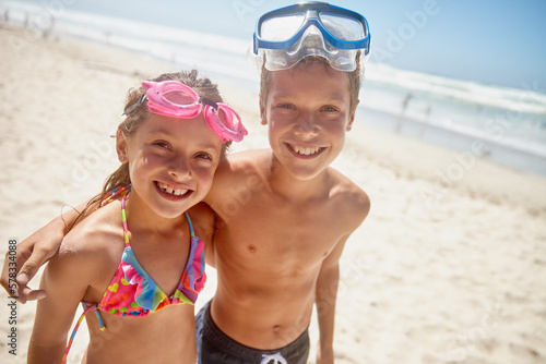 Playtime at the beach. Portrait of a brother and sister standing together on the beach. © Laflor/peopleimages.com