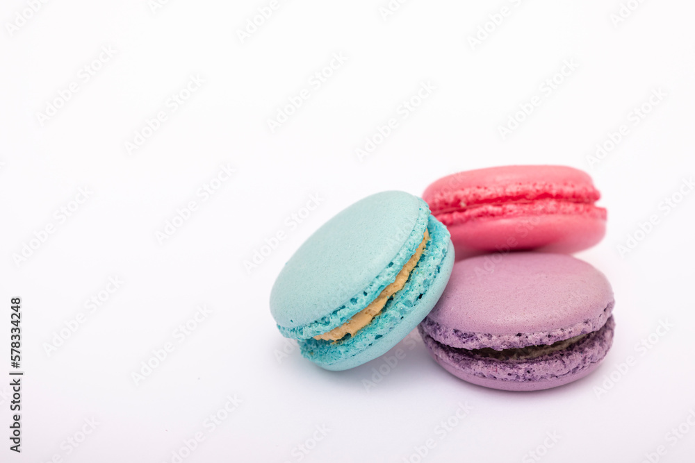 Macaroons, baked sweets from the pastry shop on white background, top view Macaroons, baked sweets from the pastry shop on white background, top view