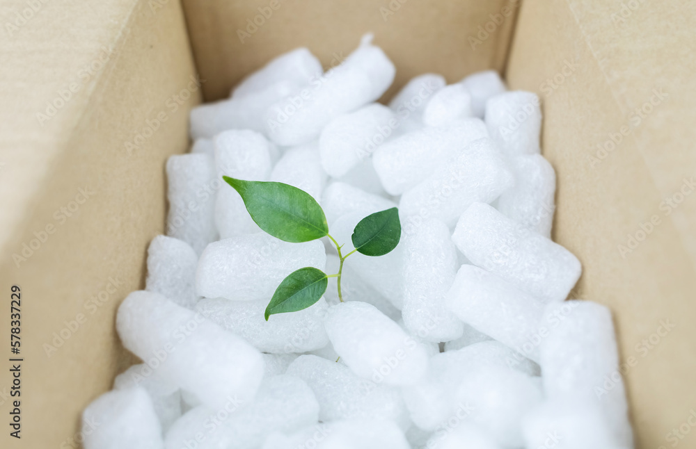 Eco package of parcels and biodegradable filler. Box is filled with a filler that does not harm the environment. Delivery of goods, parcels, delivery service, nature protection. Recycling Eco package of parcels and biodegradable filler. Box is filled with a filler that does not harm the environment. Delivery of goods, parcels, delivery service, nature protection. Recycling