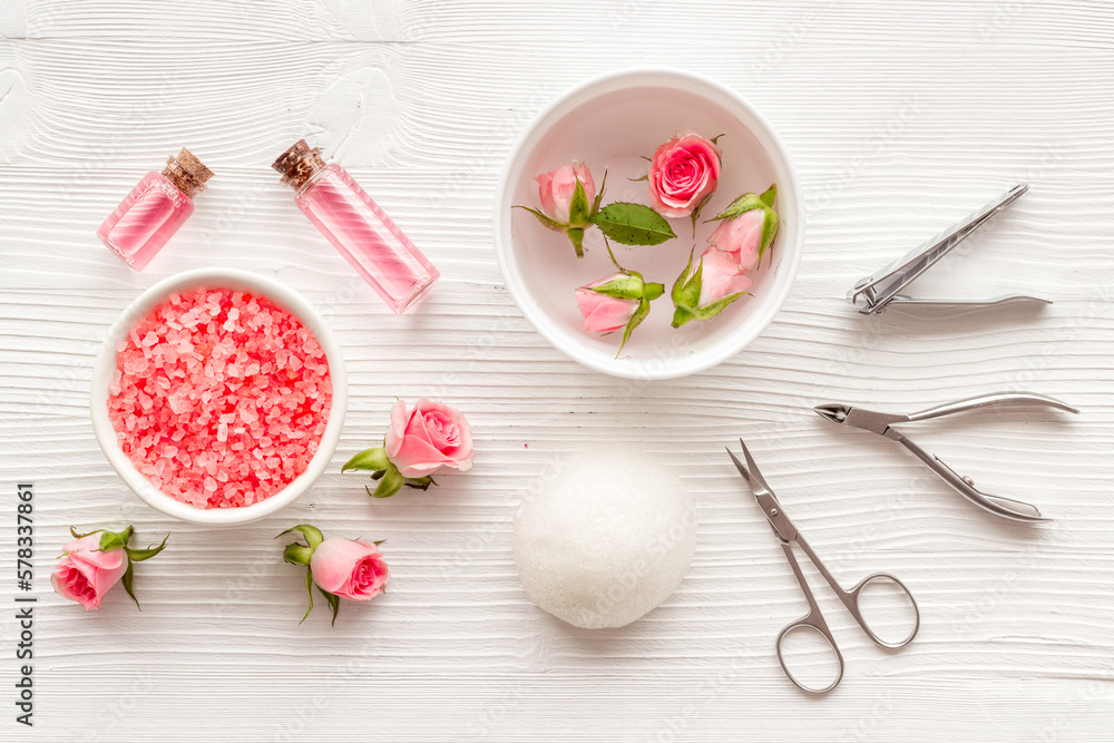 Manicure scissor and hands care cosmetics set with flowers. Manicure scissor and hands care cosmetics set with flowers.