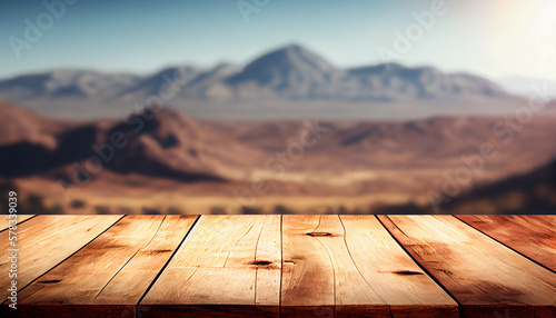 Empty wood table top with the mountain landscape. The blurred landscape of mountains background. For montage product display layout.