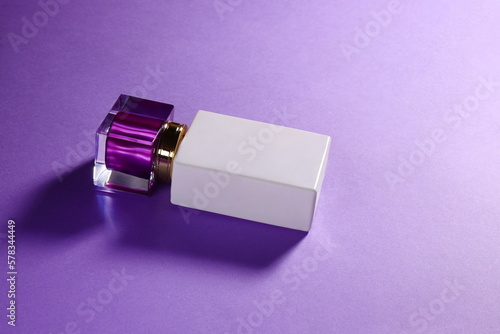 Perfume white bottle with purple top, mockup