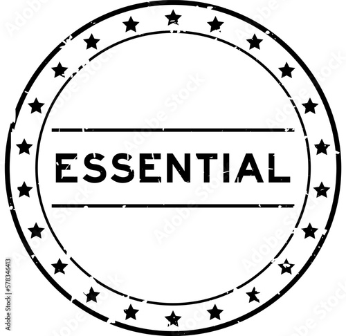 Grunge black essential word round rubber seal stamp on white background