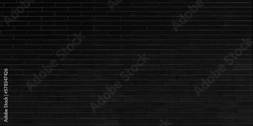 Abstract weathered black grunge brick wall texture or old surface material pattern for vintage interior room background and backdrop, architectural element in urban concept