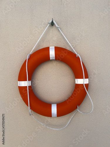 rescue ring mounted on a concrete wall photo
