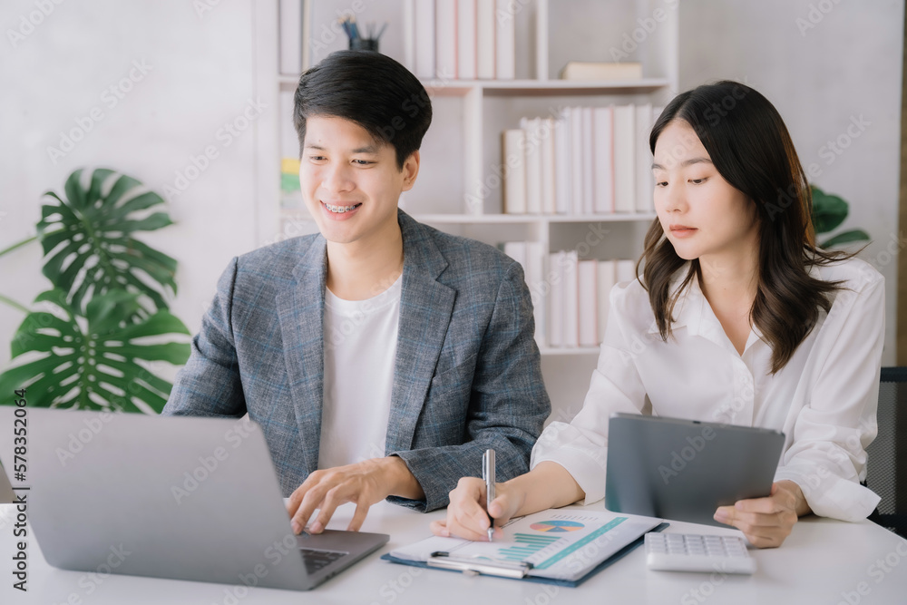 Working on their finances together, Young couple asian working on their finances at home. Working on their finances together, Young couple asian working on their finances at home.