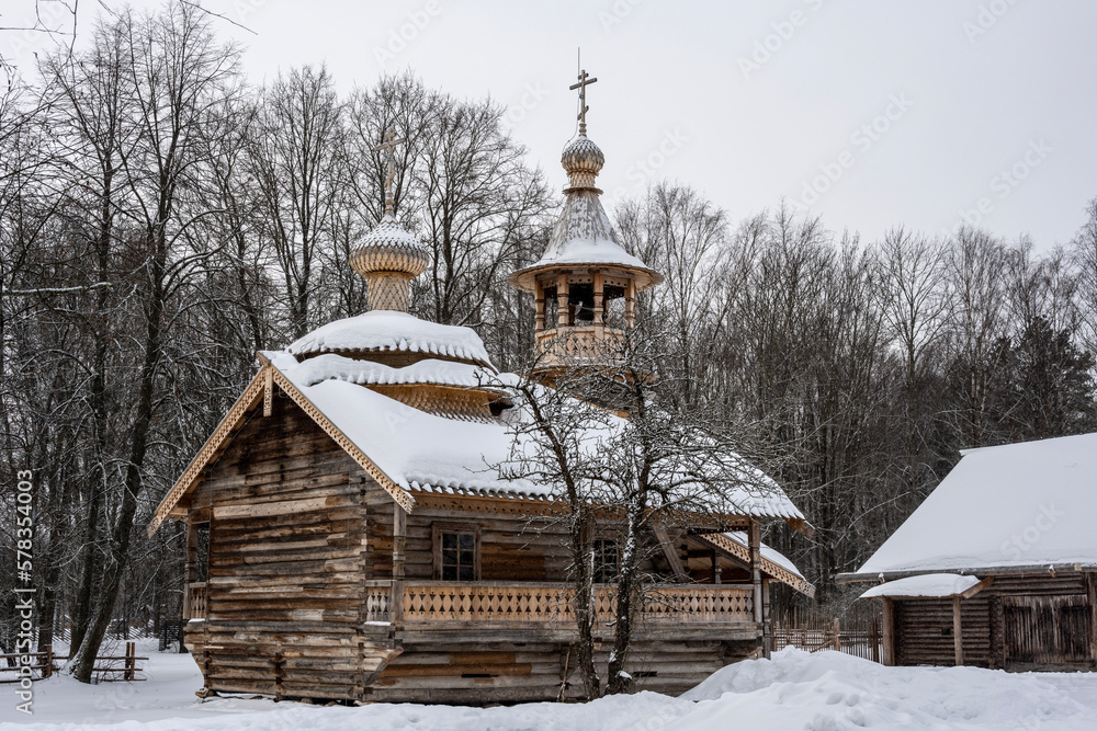 old houses and household buildings made of wooden beams according to old technologies in the vicinity of Veliky Novgorod in winter old houses and household buildings made of wooden beams according to old technologies in the vicinity of Veliky Novgorod in winter