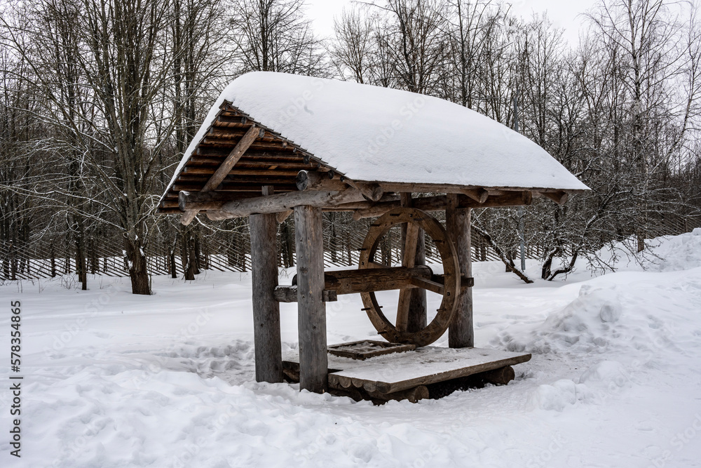 old houses and household buildings made of wooden beams according to old technologies in the vicinity of Veliky Novgorod in winter old houses and household buildings made of wooden beams according to old technologies in the vicinity of Veliky Novgorod in winter