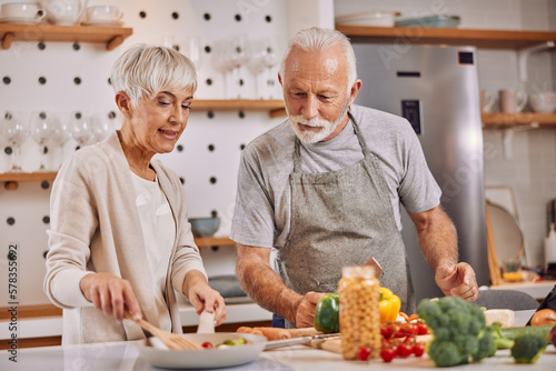 happy and healthy seniors prepare vegan food at home