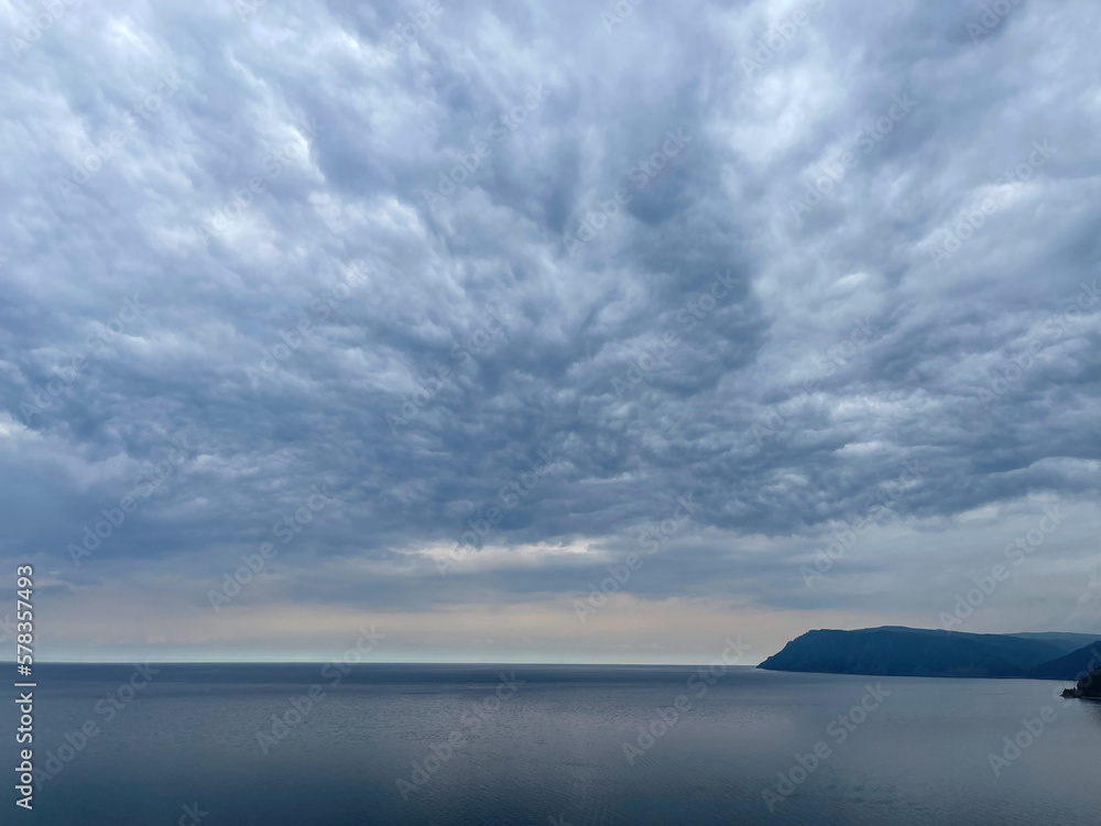 Heavy gray clouds over Baikal Lake, Russia