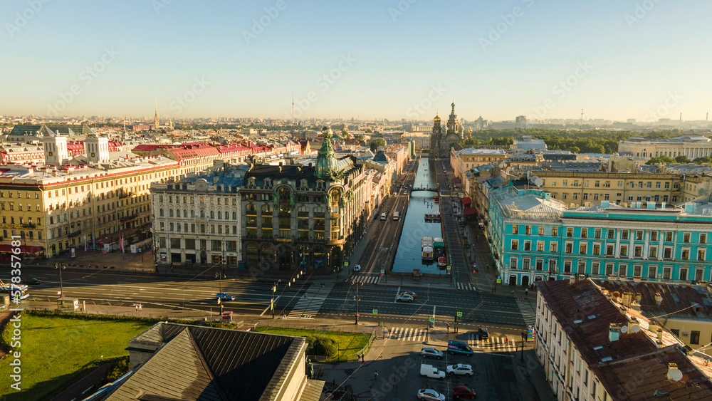 Aerial view of the Nevski street and Cathedral of the Resurrection of Christ next to House of the Singer company in the historical and at same time modern city of St.Petersburg at sunny summer sunrise