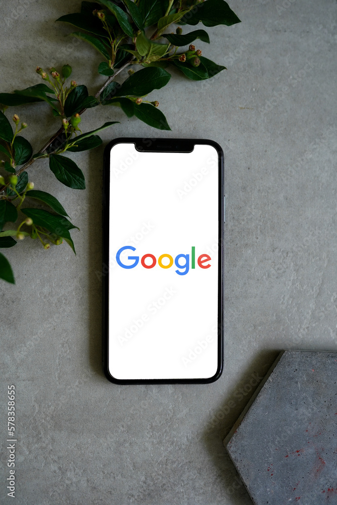 Mobile phone with the Google Logo on the screen Stock Photo | Adobe Stock