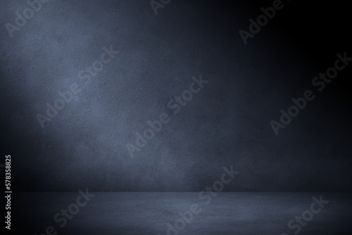 Concrete wall and floor in the dark with blue lighting. Urban concrete  background for mock up or design.