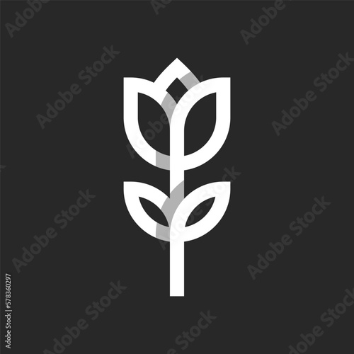 Tulip flower logo in a minimal style, one flower with a stem and leaves of white intersecting lines on a black background. Feminine symbol for boutique or beauty salon.