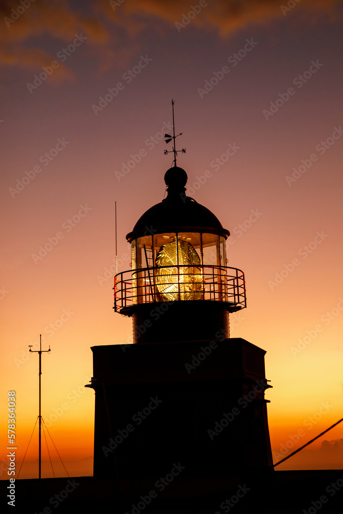 Ocean lighthouse during the sunset.