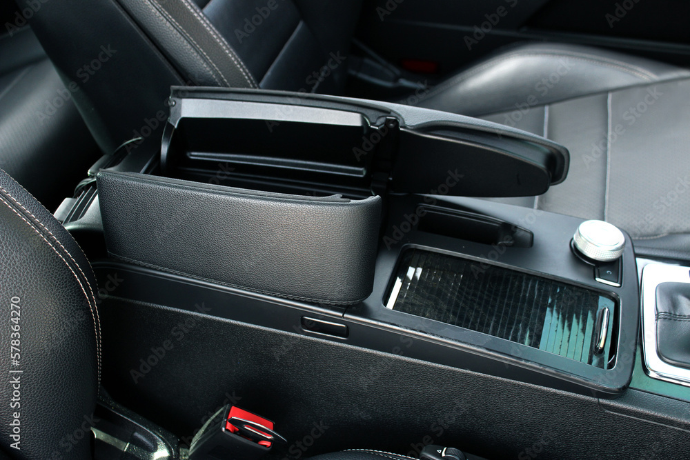 Luxury leather interior sport car. Sport car interior. Sport car armrest open. Luxury car armrest open.