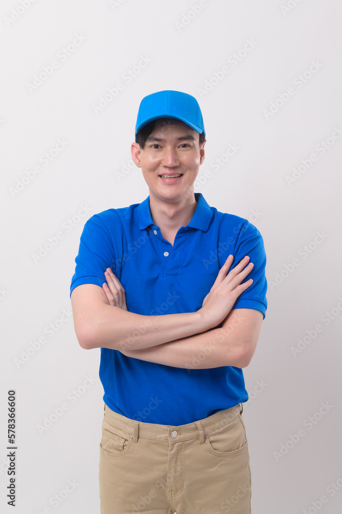 An Asian young Technician service man wearing blue uniform on white background studio