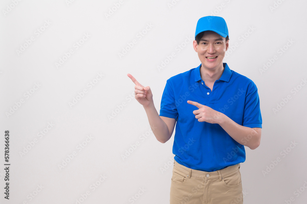An Asian young Technician service man wearing blue uniform on white background studio An Asian young Technician service man wearing blue uniform on white background studio
