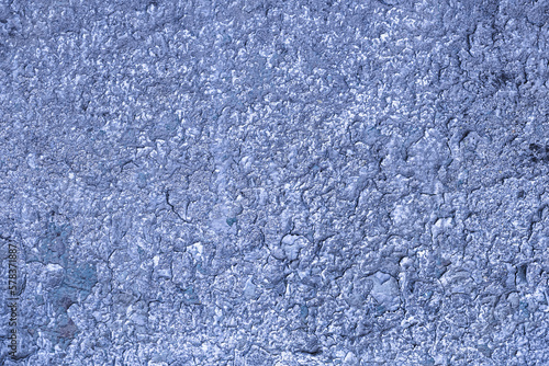 Abstract background of exposed aggregate concrete texture Blue color