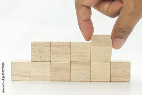 businessman hand flipping wooden blank block cubes on white background.