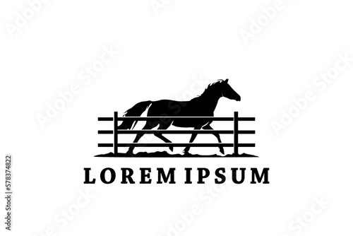 Horse silhouette behind wooden fence paddock for countryside western country farm ranch logo design