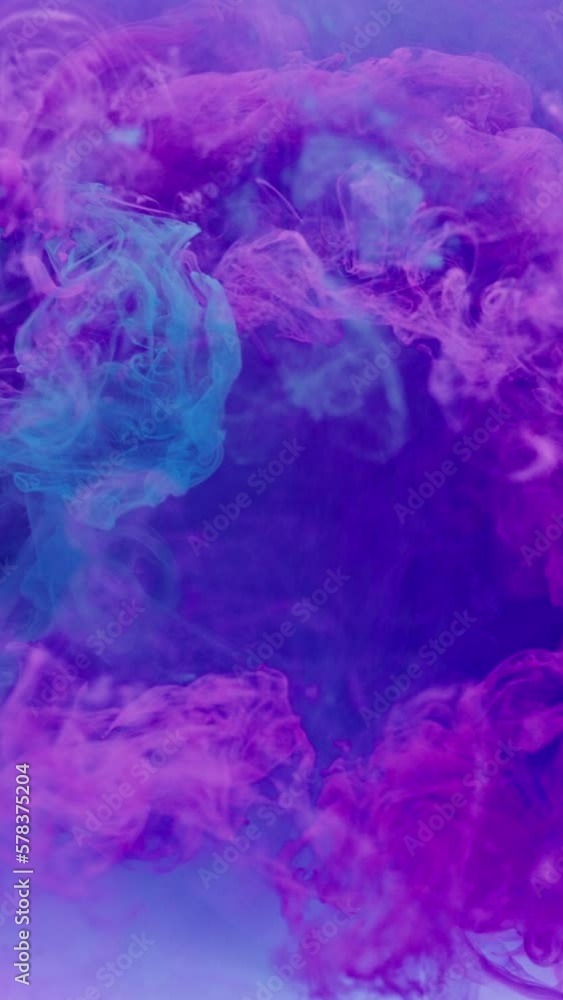Vertical video. Paint water. Fluid splash. Ink mix. Bright pink blue color smoke cloud flow blend motion abstract art background shot on RED. Vertical video. Paint water. Fluid splash. Ink mix. Bright pink blue color smoke cloud flow blend motion abstract art background shot on RED.