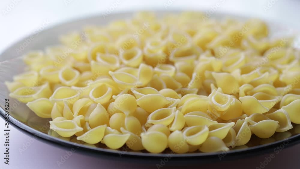 shell-shaped natural pasta rotates smoothly in a circle shell-shaped natural pasta rotates smoothly in a circle