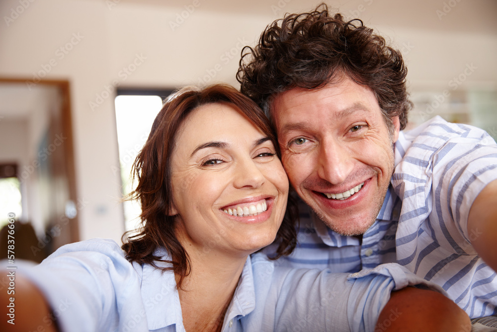 Say selfie. a husband and wife taking a selfie together at home. Say selfie. a husband and wife taking a selfie together at home.