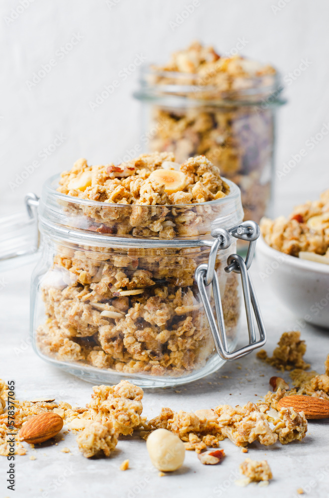 Granola with Nut Mix on Bright Concrete Background, Healthy Vegan Snack or Breakfast Granola with Nut Mix on Bright Concrete Background, Healthy Vegan Snack or Breakfast