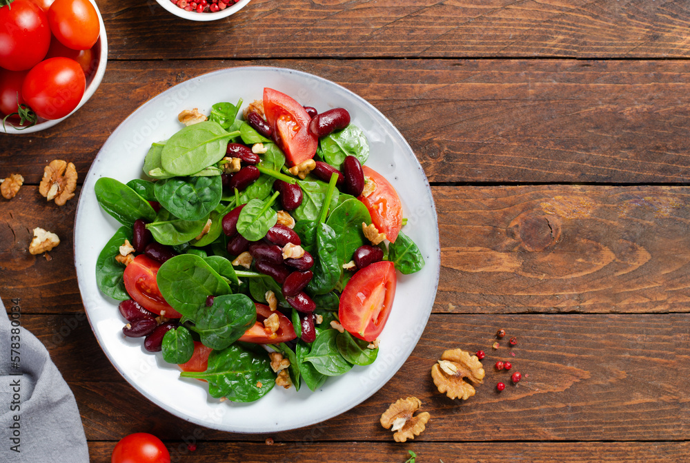Red Bean Salad On Wooden Background, Fresh Salad with Spinach, Cherry Tomatoes, Walnuts, Beans and Mustard Dressing Red Bean Salad On Wooden Background, Fresh Salad with Spinach, Cherry Tomatoes, Walnuts, Beans and Mustard Dressing