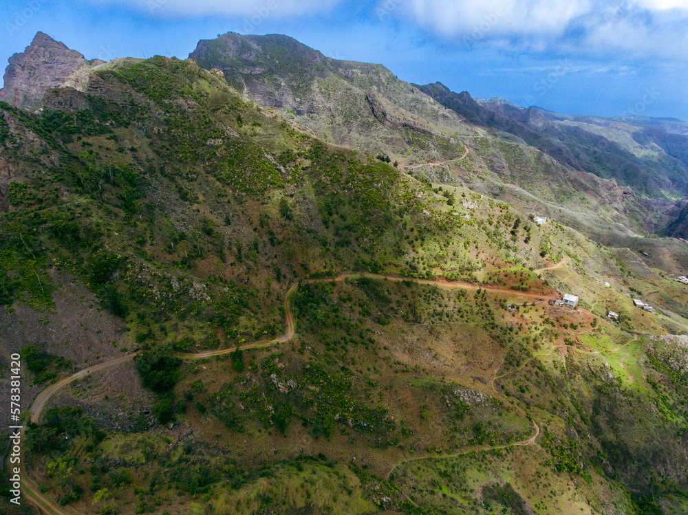 Fototapeta premium Aerial photos of Serra de Malagueta in Santiago Island Cabo Verde capture the stunning natural beauty of this mountain range, with its rugged terrain, lush vegetation, and breathtaking views