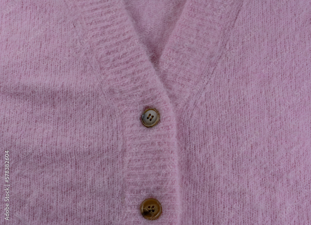 Rosa Mohair und Alpaka Wolle von einer Strickjacke als Hintergrund Rosa Mohair und Alpaka Wolle von einer Strickjacke als Hintergrund