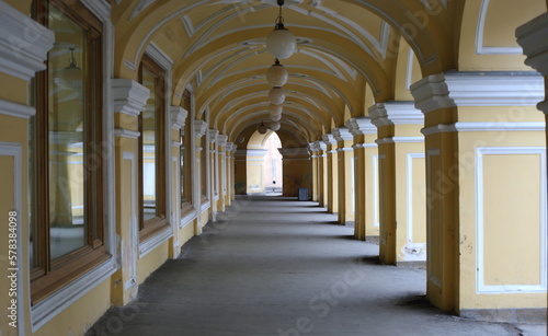 Yellow arched Colonnade of the Old Gostiny Dvor, Dumskaya Street, St. Petersburg, Russia, february2023