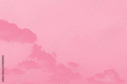 Pink clouds on light pink sky background,